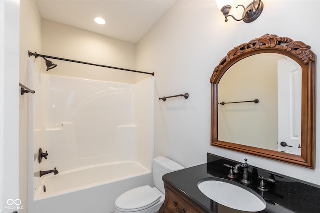 bathroom featuring shower / washtub combination, vanity, and toilet