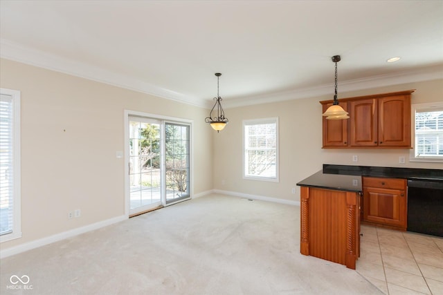 kitchen with brown cabinets, decorative light fixtures, dark countertops, plenty of natural light, and dishwasher