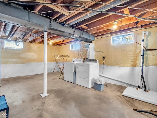 basement featuring plenty of natural light and washer and dryer