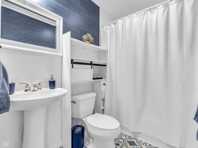 bathroom featuring a sink and toilet