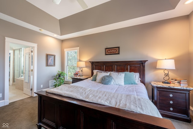 bedroom featuring recessed lighting, dark carpet, and connected bathroom