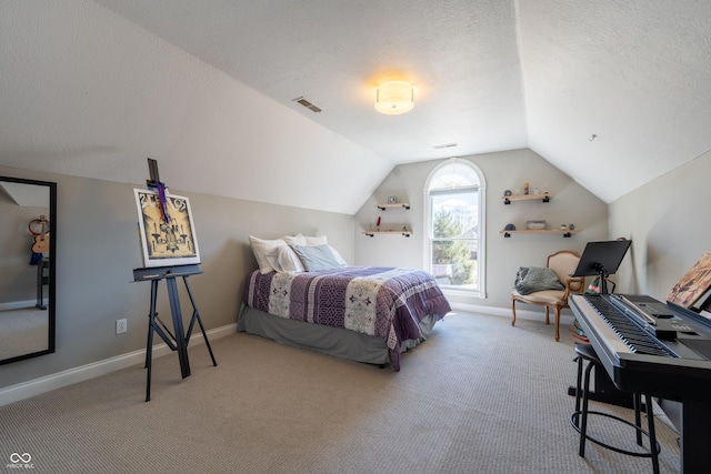 carpeted bedroom featuring visible vents, lofted ceiling, a textured ceiling, and baseboards