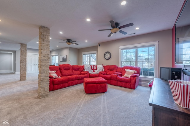 carpeted living room with recessed lighting, visible vents, a ceiling fan, and ornate columns