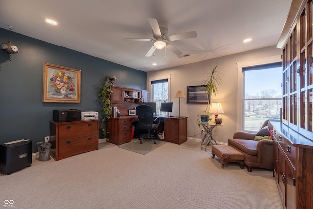 office featuring recessed lighting, light colored carpet, visible vents, and ceiling fan