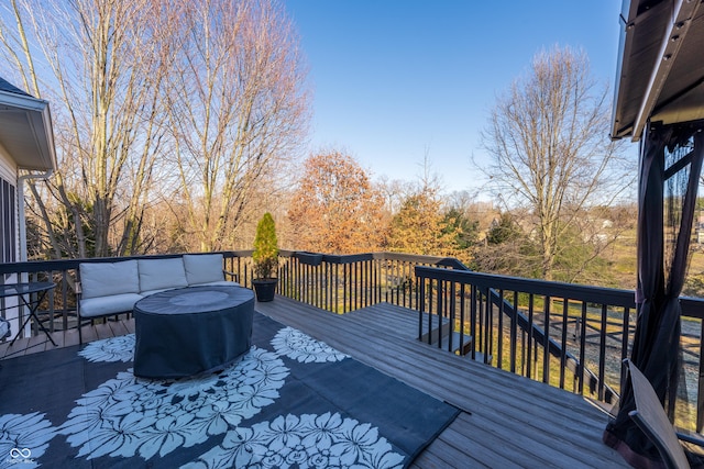 wooden terrace with outdoor lounge area