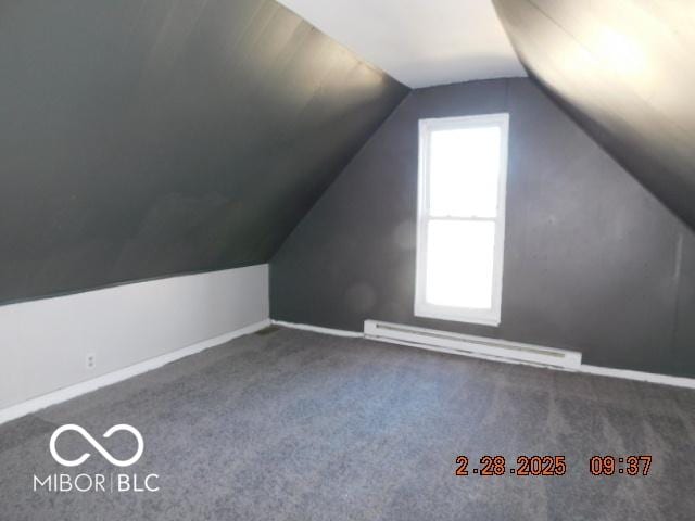 bonus room with lofted ceiling, carpet floors, baseboards, and a baseboard heating unit