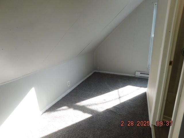 bonus room with lofted ceiling, a baseboard radiator, carpet flooring, and baseboards