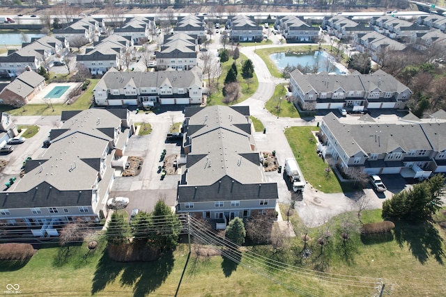 bird's eye view with a residential view and a water view