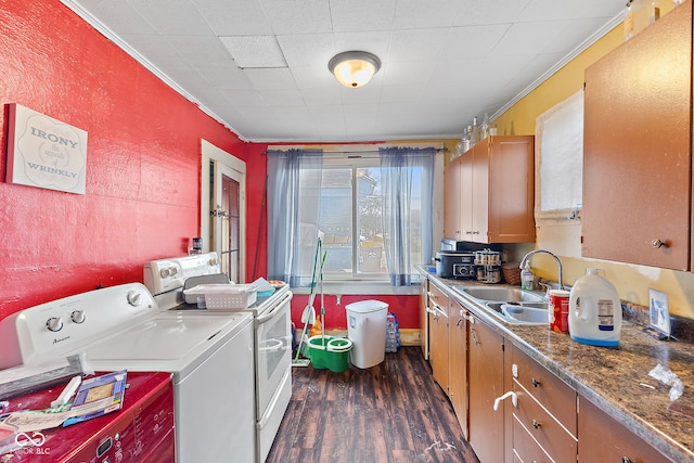 interior space featuring independent washer and dryer, a sink, dark wood finished floors, and crown molding