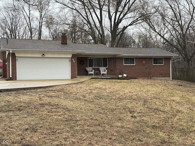 single story home with a garage, a chimney, and brick siding