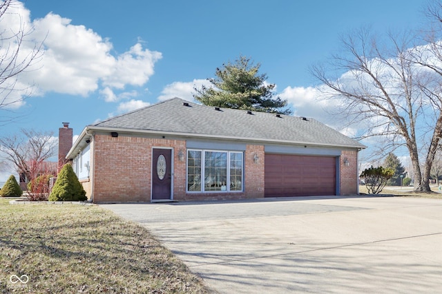 single story home featuring concrete driveway, brick siding, and a shingled roof