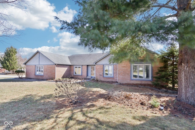 single story home with brick siding