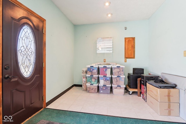 entryway featuring baseboards