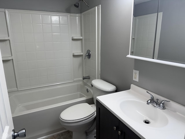 bathroom featuring bathtub / shower combination, vanity, and toilet