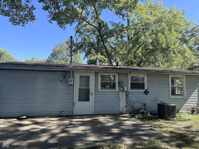 exterior space with a patio area and central AC unit