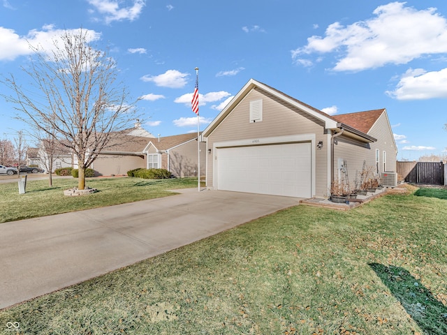 single story home with a front yard, fence, driveway, roof with shingles, and an attached garage