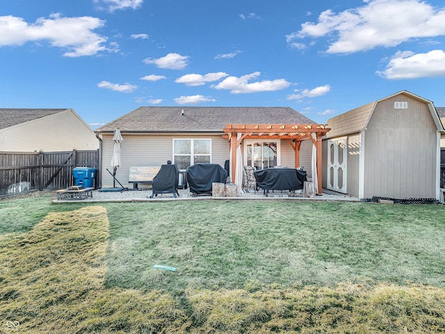 back of property with an outbuilding, a lawn, a pergola, a fenced backyard, and a shed