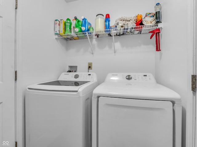 laundry room featuring washer and dryer and laundry area