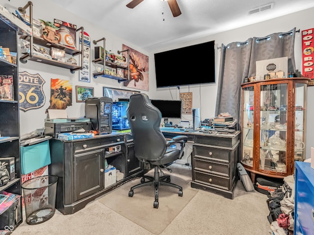 office featuring visible vents and a ceiling fan