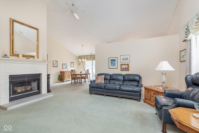 carpeted living area featuring high vaulted ceiling, ceiling fan, and a fireplace