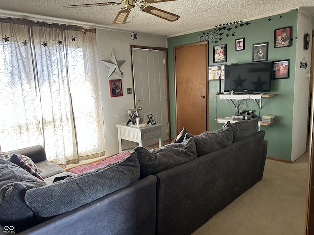 carpeted living room with a ceiling fan and a textured ceiling