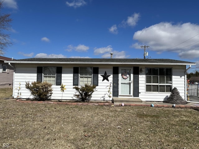 ranch-style house featuring a front lawn