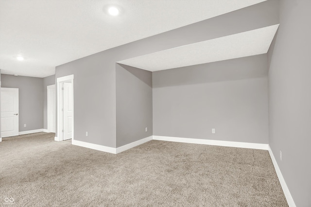 bonus room featuring carpet and baseboards