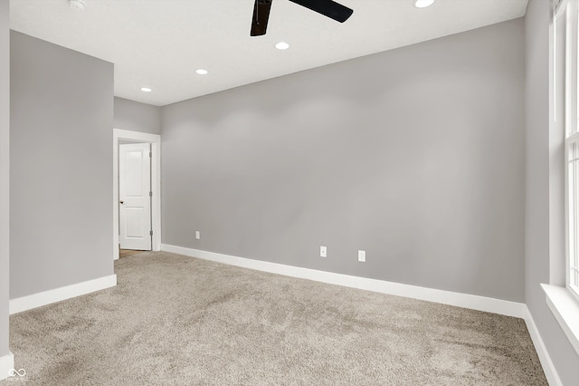 carpeted spare room with ceiling fan, baseboards, and recessed lighting