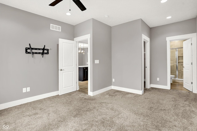 unfurnished bedroom featuring carpet, visible vents, baseboards, and recessed lighting