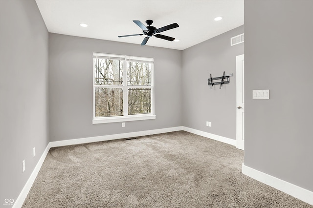 unfurnished room featuring ceiling fan, recessed lighting, carpet flooring, visible vents, and baseboards