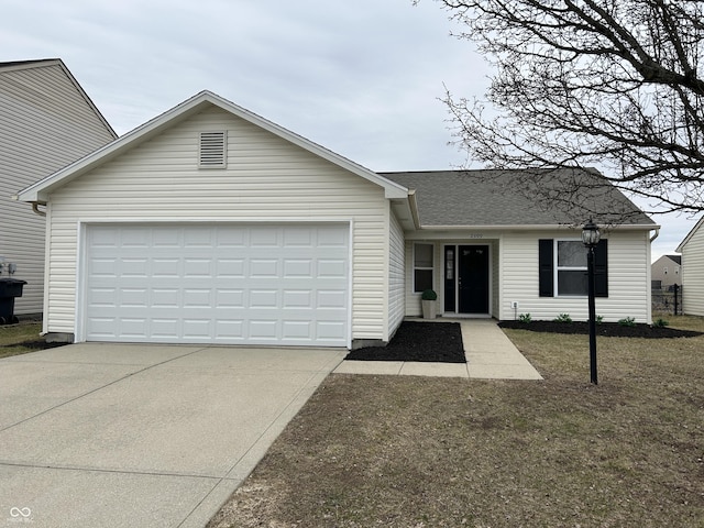 single story home with a garage, driveway, and roof with shingles