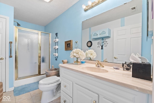 full bath featuring vanity, tile patterned flooring, a shower stall, and toilet