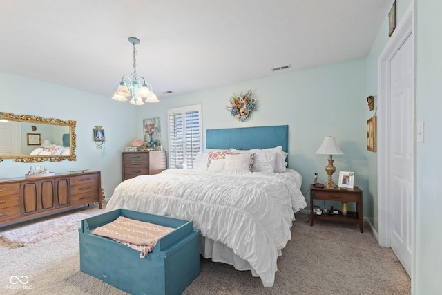 bedroom featuring a chandelier, carpet, and visible vents