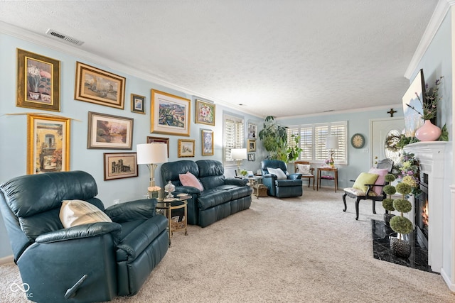 living room featuring visible vents, a fireplace with flush hearth, a textured ceiling, crown molding, and carpet flooring