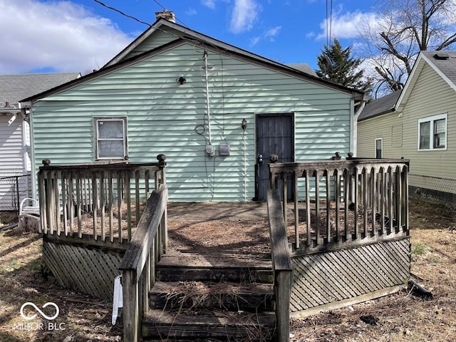 rear view of property with a deck