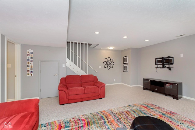 living room with stairs, recessed lighting, carpet, and visible vents