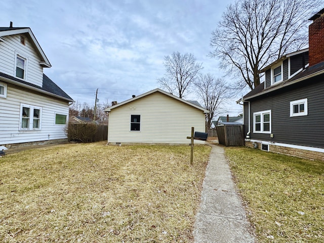 view of side of property with a yard