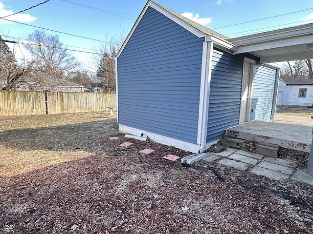 view of outdoor structure featuring fence