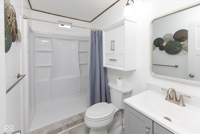 full bathroom featuring a stall shower, vanity, and toilet