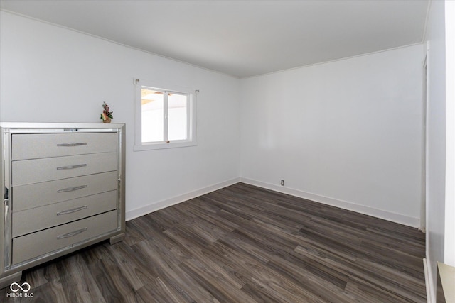 unfurnished bedroom featuring dark wood-style floors and baseboards