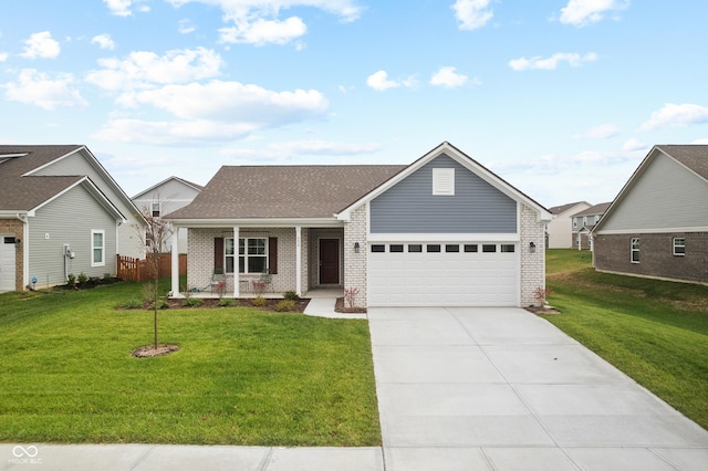 view of front facade featuring a porch, an attached garage, brick siding, driveway, and a front yard