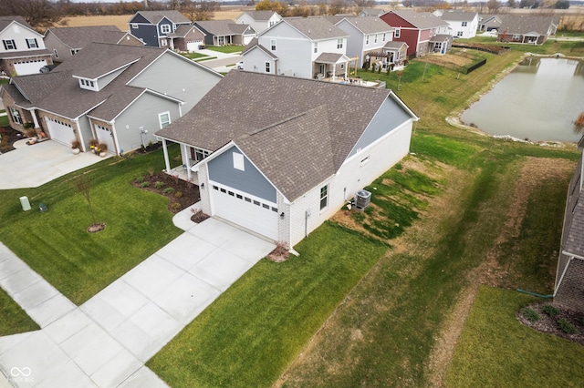 bird's eye view with a water view and a residential view