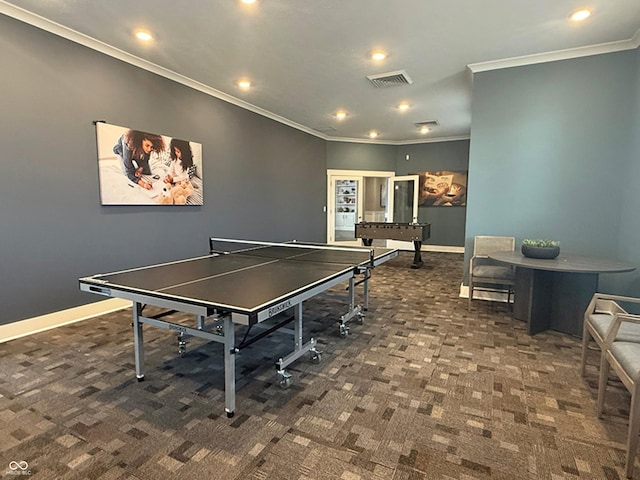 rec room featuring carpet, visible vents, baseboards, and ornamental molding