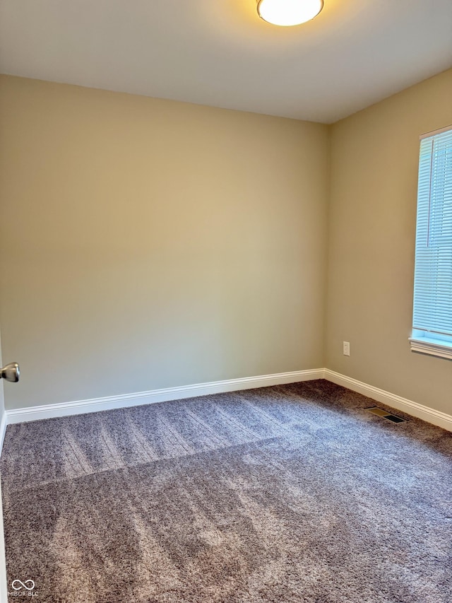 859 N Oakland Ave, Indianapolis, IN 46201 - carpeted empty room featuring baseboards