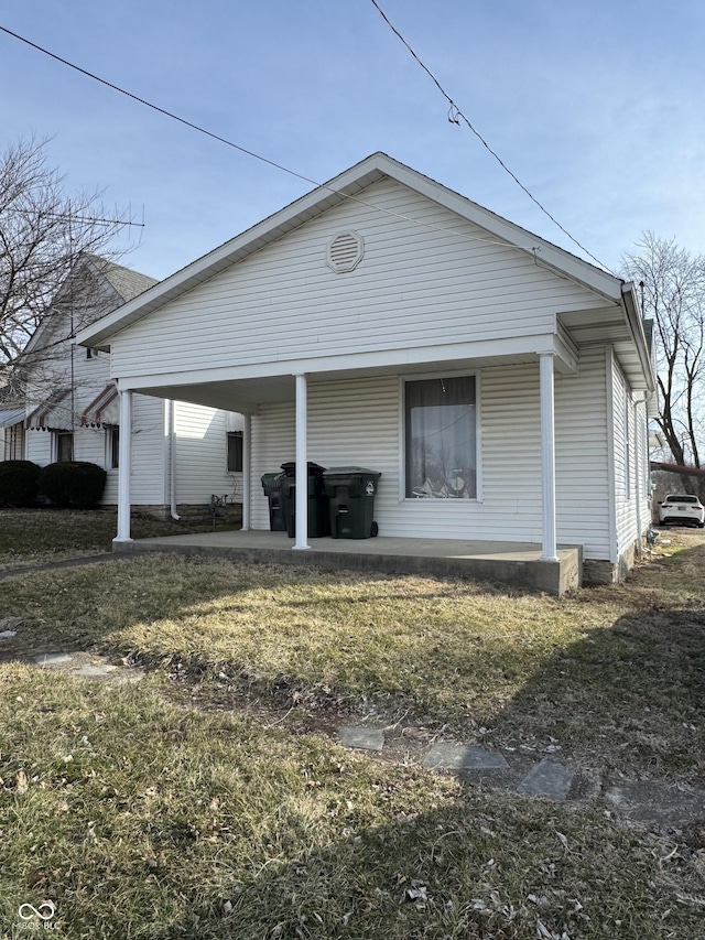 view of side of property with a carport