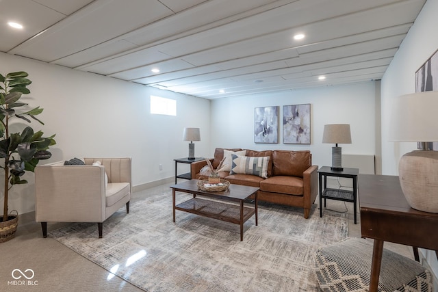 living area with baseboards and recessed lighting