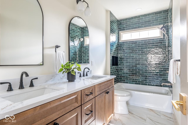 full bathroom featuring marble finish floor, a sink, toilet, and double vanity