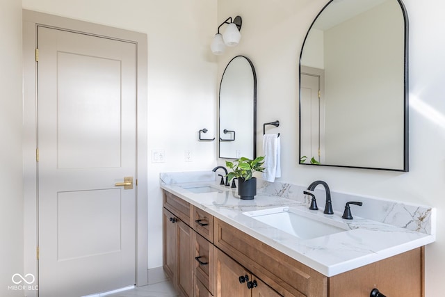 full bathroom featuring double vanity and a sink