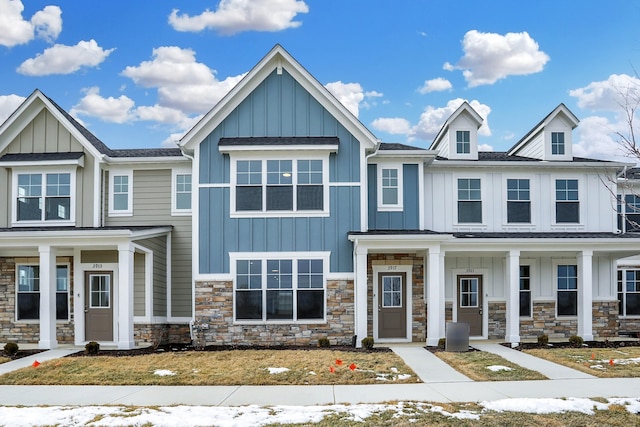 multi unit property with stone siding and board and batten siding