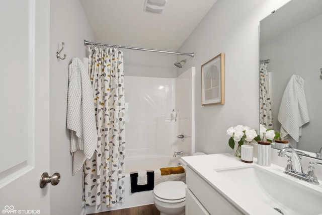 full bath featuring shower / bath combo, visible vents, vanity, and toilet